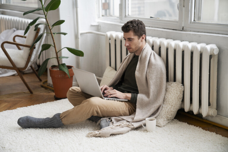 close-up-person-near-heater