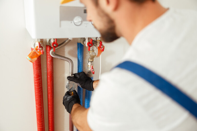 Engineer servicing a boiler