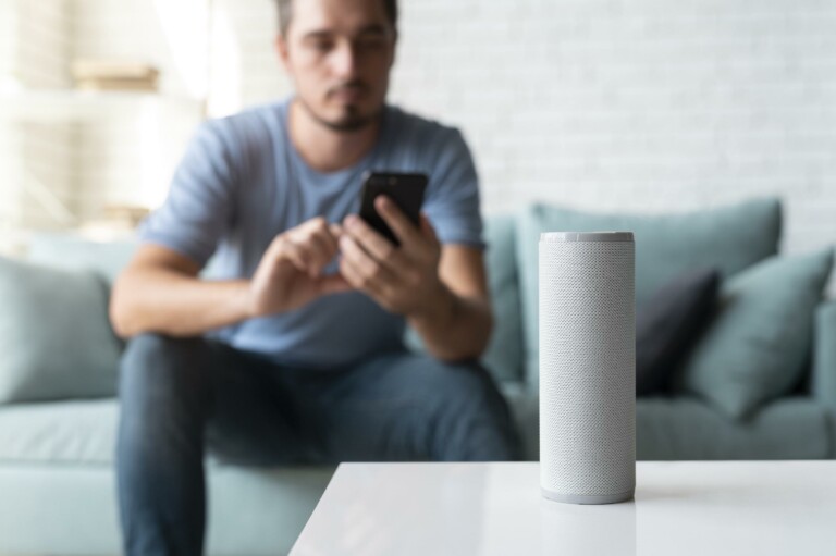 man-using-speaker-digital-assistant