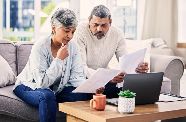 senior couple comparing boiler contracts