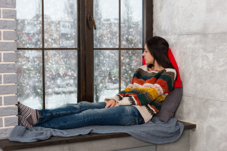 Young woman by window