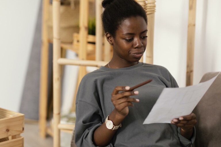 Woman reading boiler documents